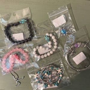 Assorted nautical bracelets and necklaces.